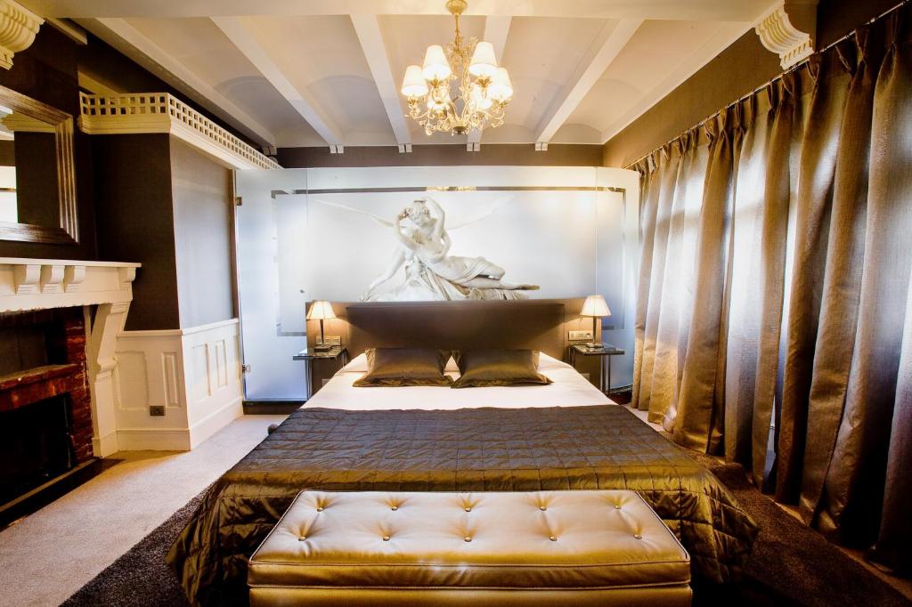 Cama o camas de una habitación en Hotel Castillo El Collado