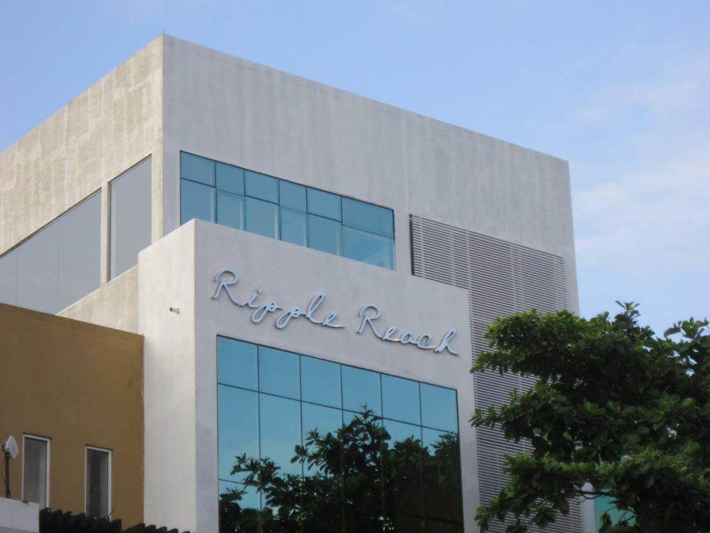 a building with the ruttle radio sign on it at Ripple Reach Apartments in Galle