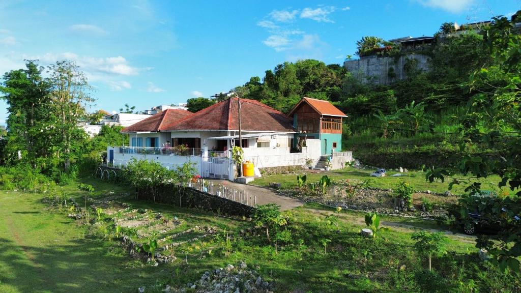 a house on the side of a hill at Nuansa Timur Residence in Jimbaran