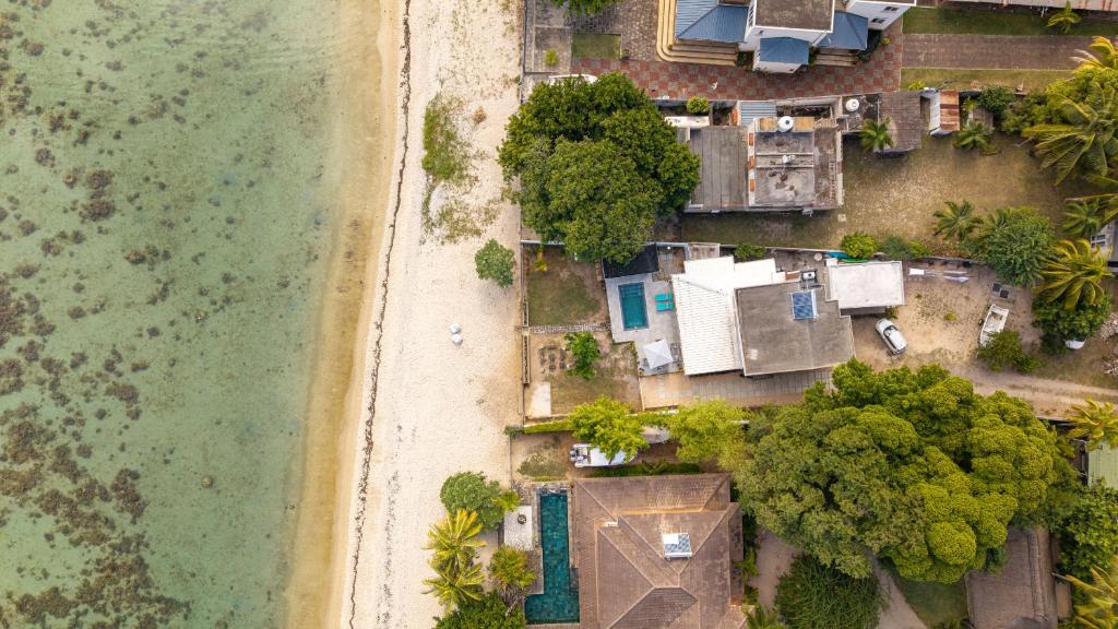 an overhead view of a beach and the ocean at Villa Pwani in Baie du Tombeau