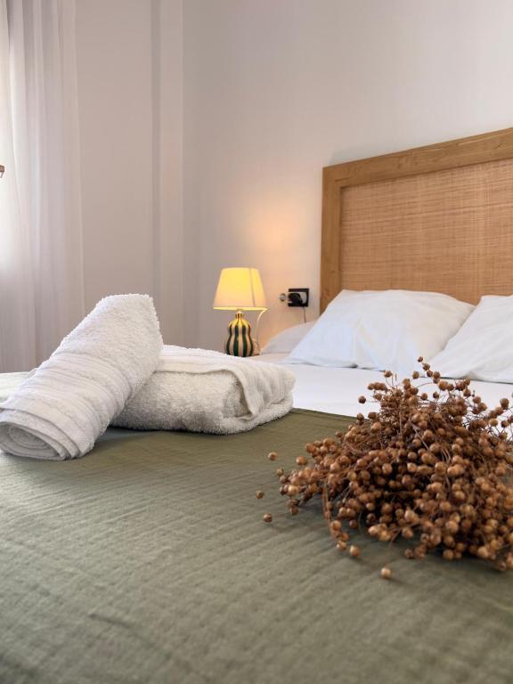 a pile of nuts on a bed in a bedroom at Itxinako Balkoia in Murueta-Orozko