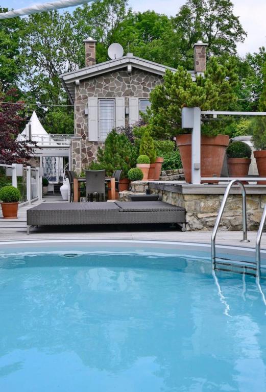 a swimming pool in front of a house at Erfurt Haus Paradies in Erfurt