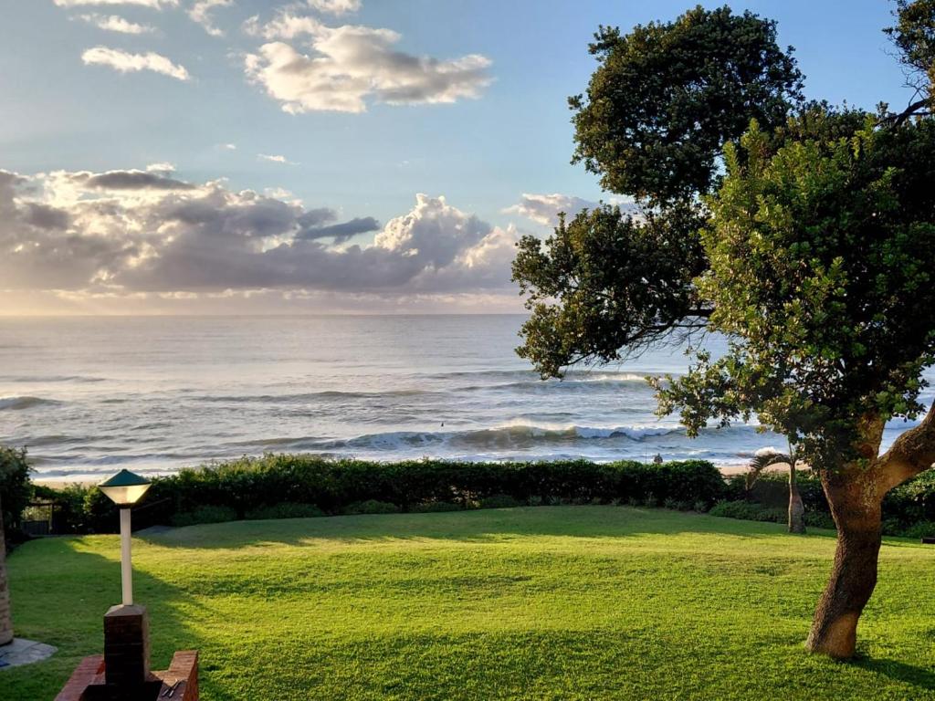 a view of the ocean from a golf course at Anguna Holiday Flats in Margate