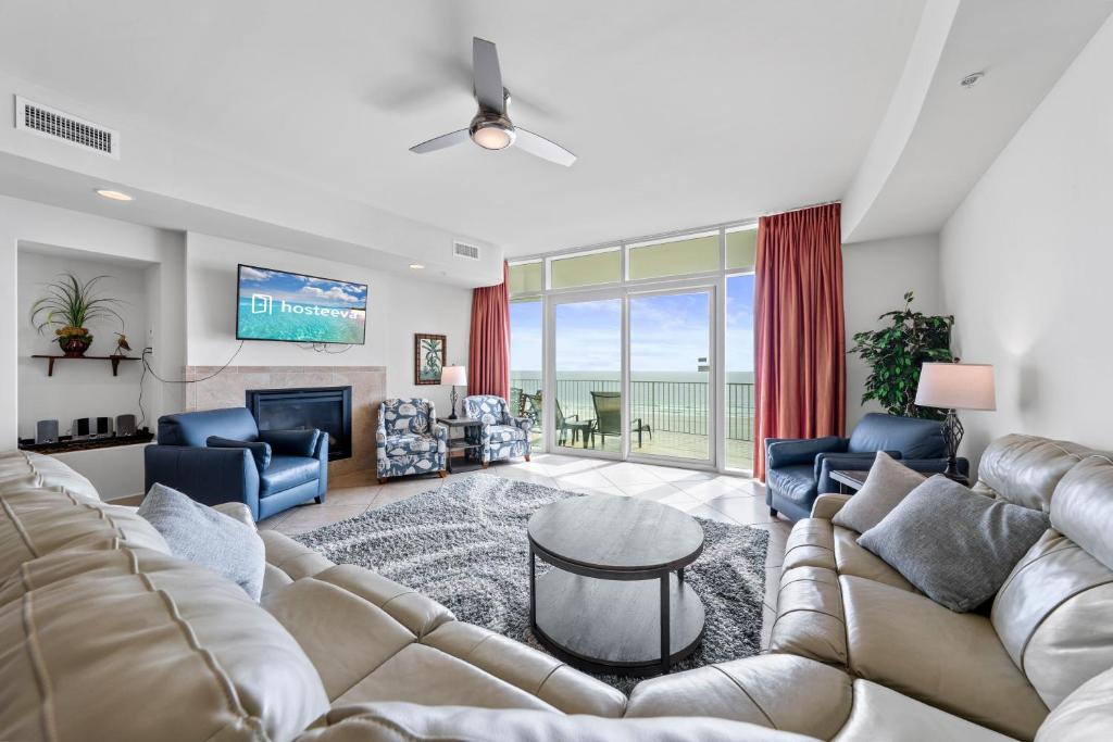 a living room with a large couch and a tv at Turquoise Place 408C in Orange Beach