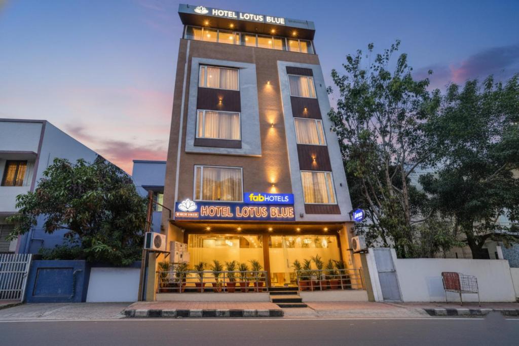 a tall building with a sign on it at FabHotel Lotus Blue in Bhopal