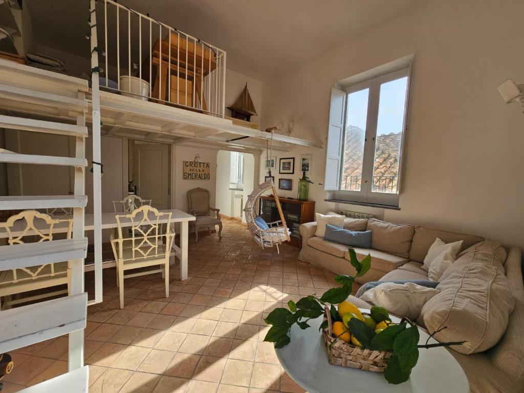 a living room with a couch and a table at Bell' Antonio Sea View in Minori