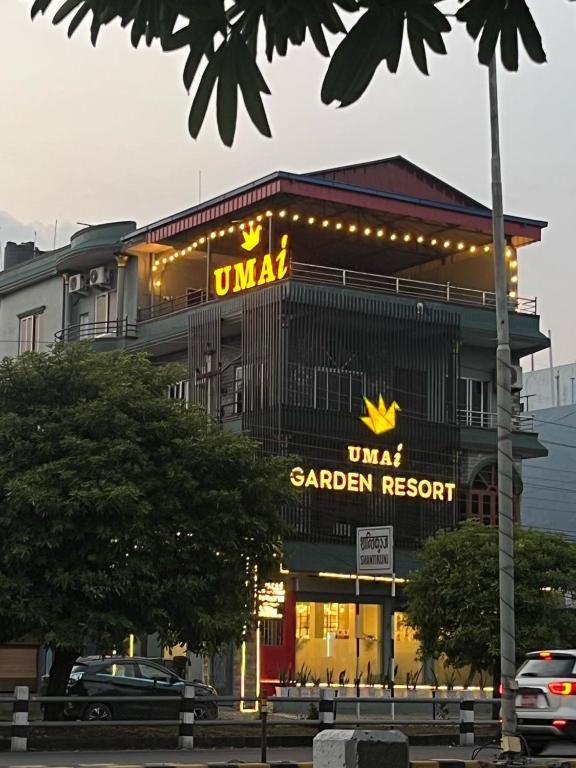 a building with a sign for a sauer restaurant at Umai Garden Resort in Jogīkuti