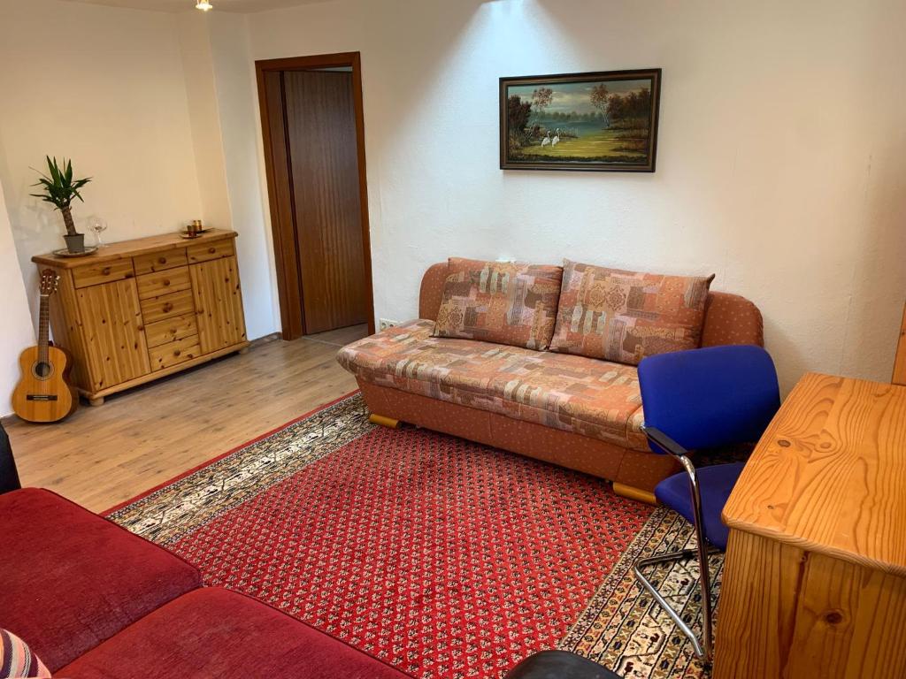 a living room with a couch and a table at Business Apartment Herne-Wanne in Herne