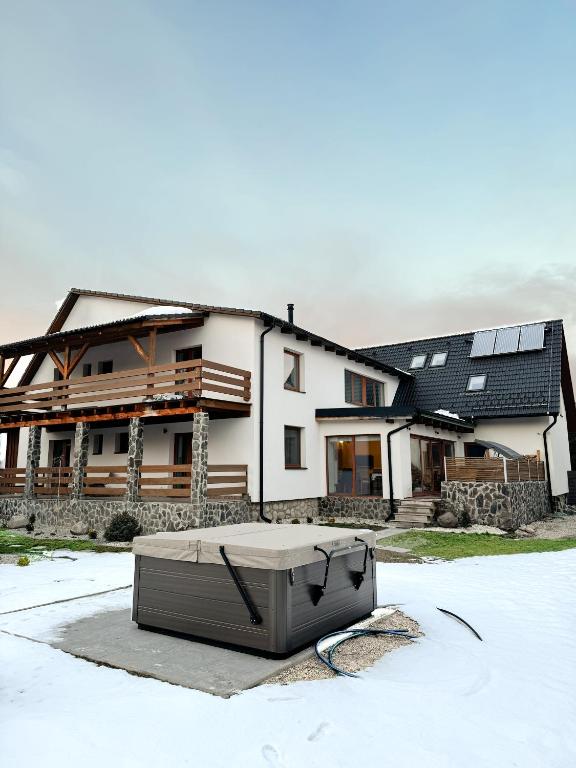 a house with a mattress in front of it at Chalet pri studenom potoku in Stará Lesná