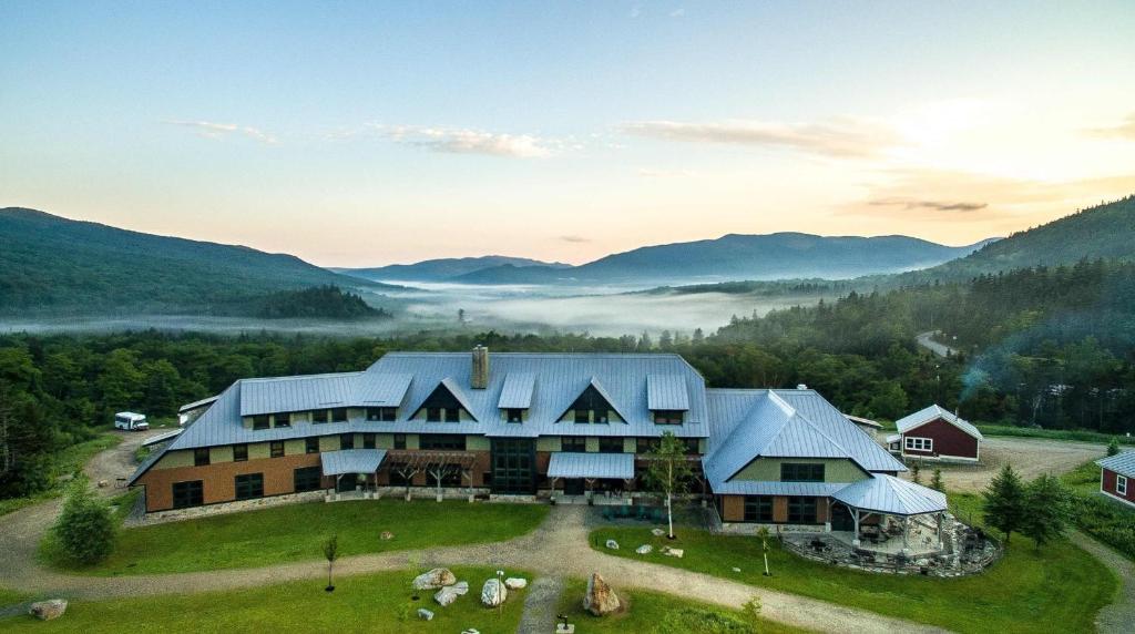 an aerial view of a barn in the mountains at Highland Center in Bretton Woods