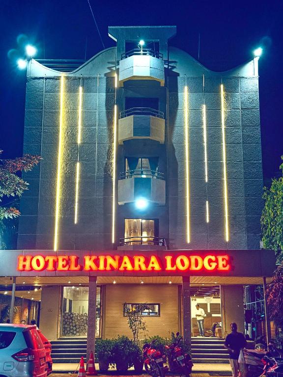a hotel kimma lodge with a sign in front of it at Hotel Kinara Lodge in Jāmkhed