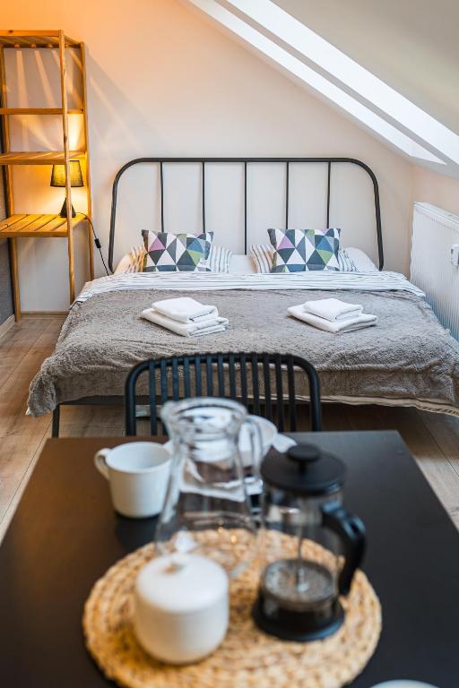 a bedroom with a bed and a table with a coffee table sidx sidx sidx at V&D 7 by Mountain ways in Rokytnice nad Jizerou