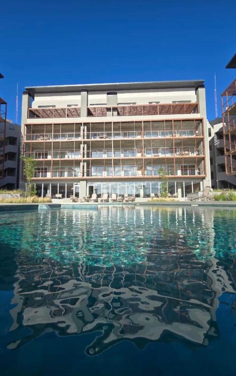 a building with water in front of it at Departamento de mar- UF5-La Reserva Almarena in Costa del Este