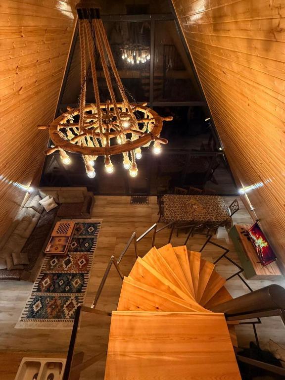 an overhead view of a room with a chandelier at A-frame , Quba Qecres in Qǝçrǝş