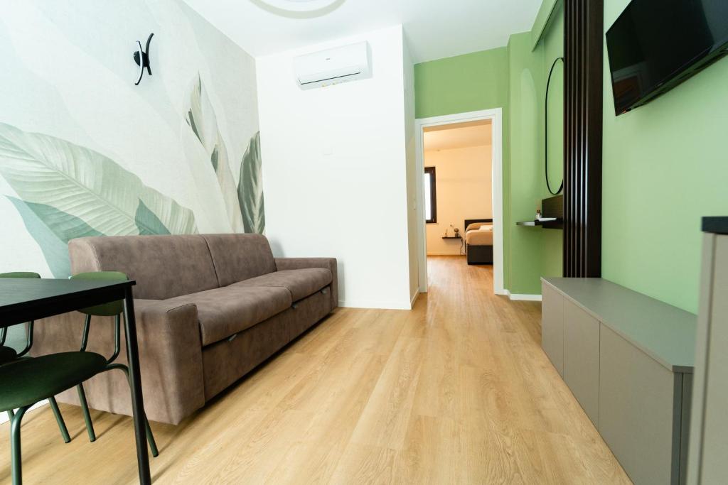 a living room with a couch and a table at Verdechiaro village in Roseto degli Abruzzi