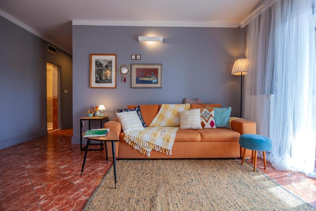 a living room with a couch and a table at Apartmani Vale 2 in Hvar