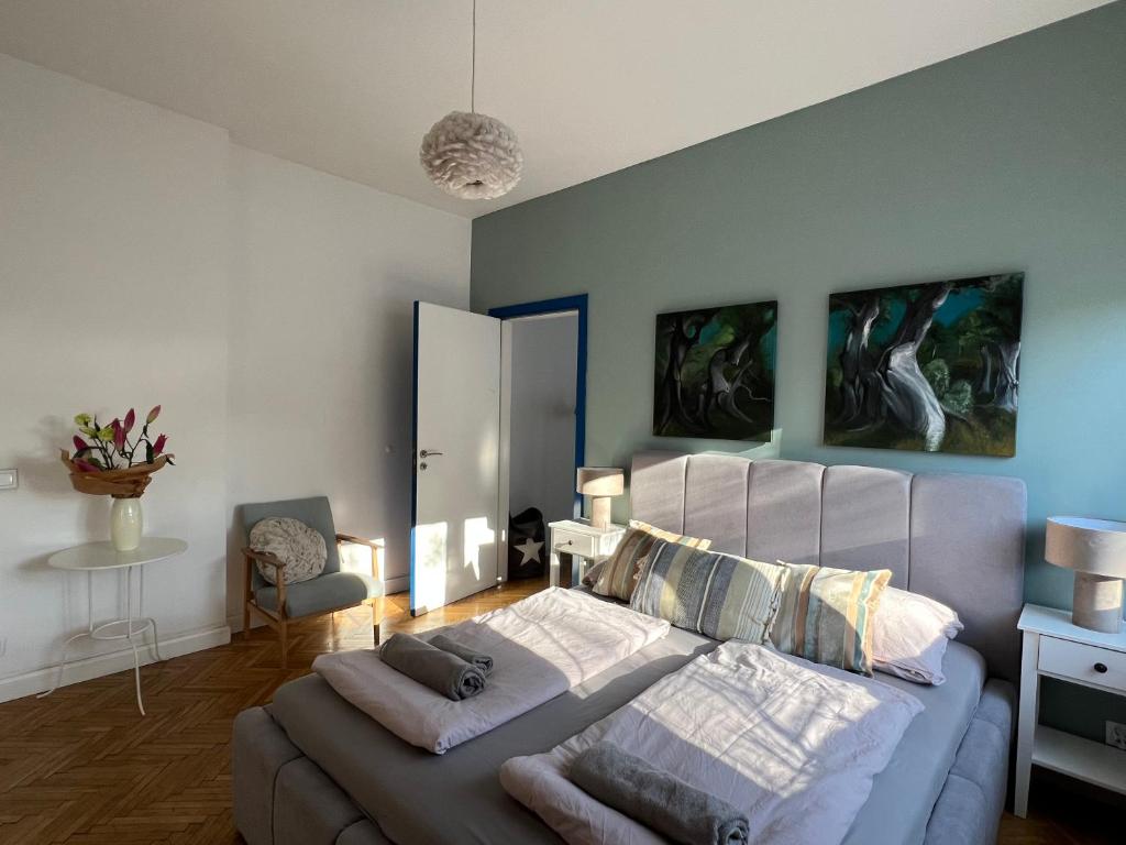 a bedroom with a large bed and a couch at Apartamenty Rajcza in Rajcza