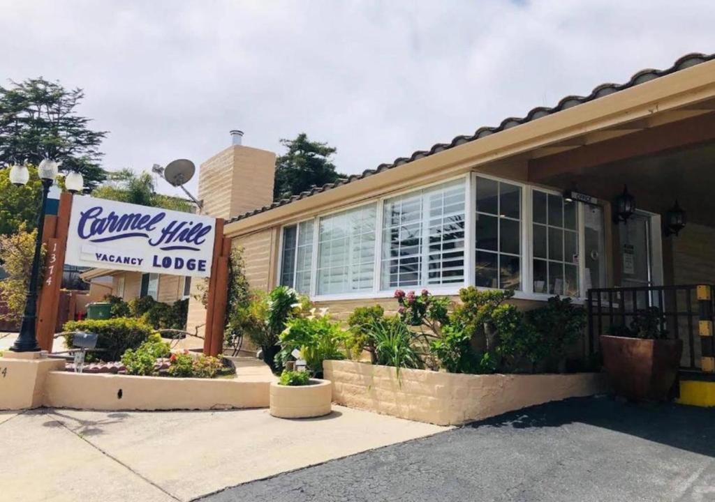 a coffee shop with a sign in front of it at Carmel Hill Lodge in Monterey
