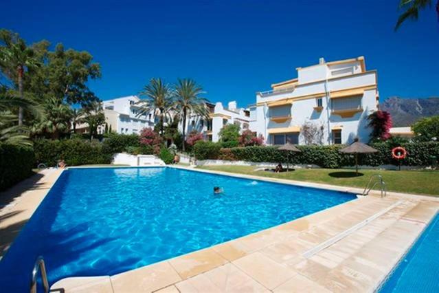 a large swimming pool in front of a building at Luxury House Golden Mile Marbella in Marbella