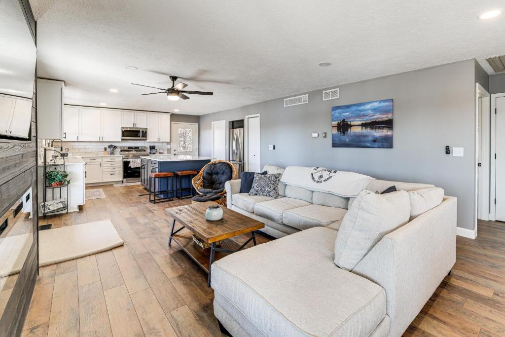 a living room with a couch and a table at Waterfront Deck, Shell Knob Gem on Table Rock! in Shell Knob