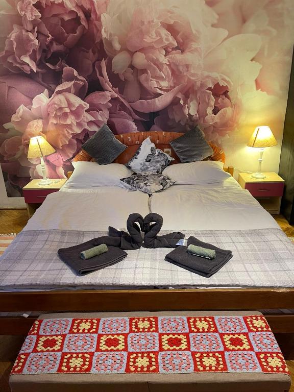 a bedroom with a bed with two bow ties on it at Casa Dalia 1 in Sighişoara