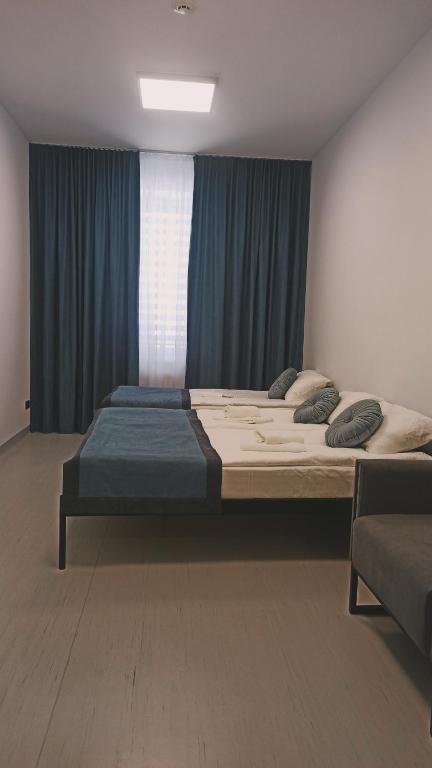 En eller flere senge i et værelse på Impuls Prof Hotel