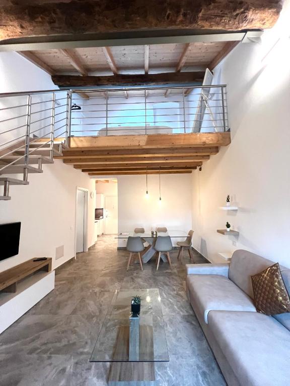 a living room with a couch and a table at R&V Apartments - Nel cuore di La Spezia in La Spezia