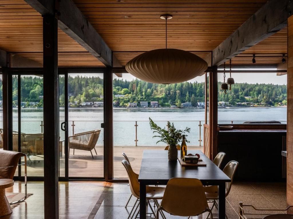 a dining room with a table and a view of the water at The Bald Seagle in Port Orchard