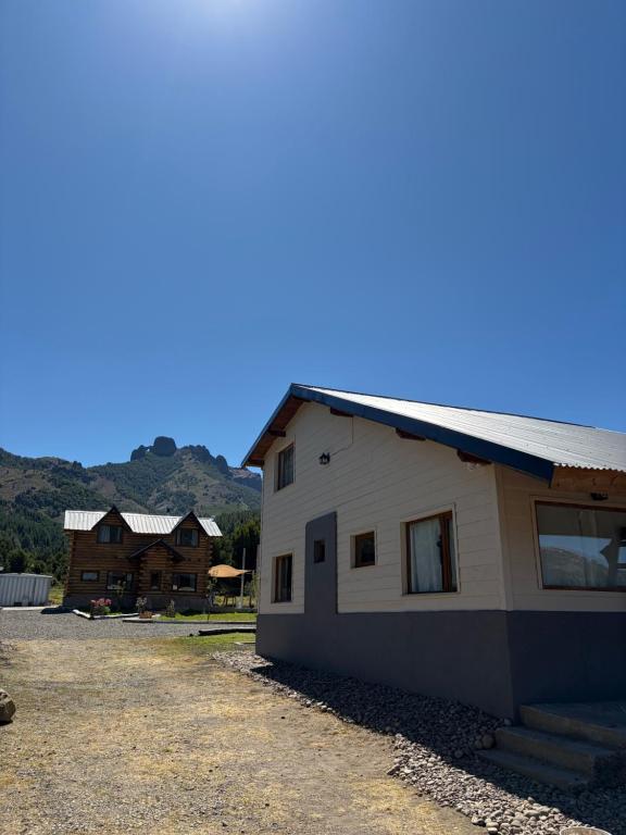 a building that is next to a house at Betsaida2 in Lago Meliquina