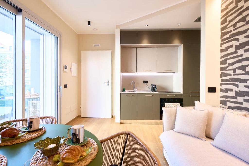 a living room with a table and a couch at A la plage R in San Benedetto del Tronto