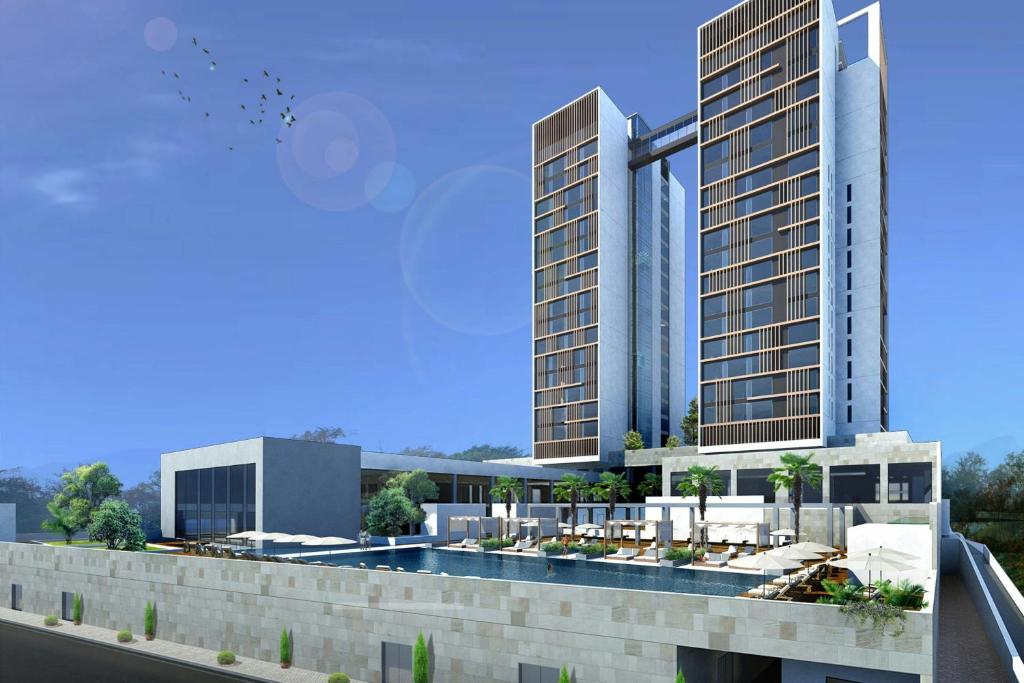 an artist rendering of a planned hotel complex with two tall buildings at Kampala Marriott Hotel in Kampala
