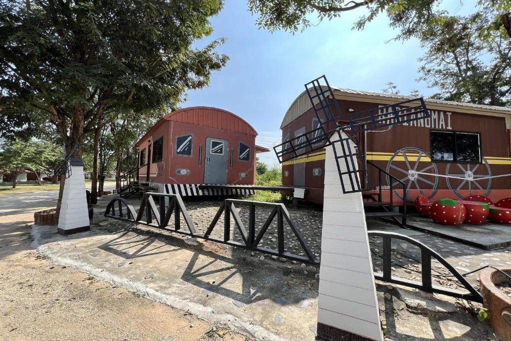 a playground in a park with a train at Rabiangmai Resort in Ban Ko Krang