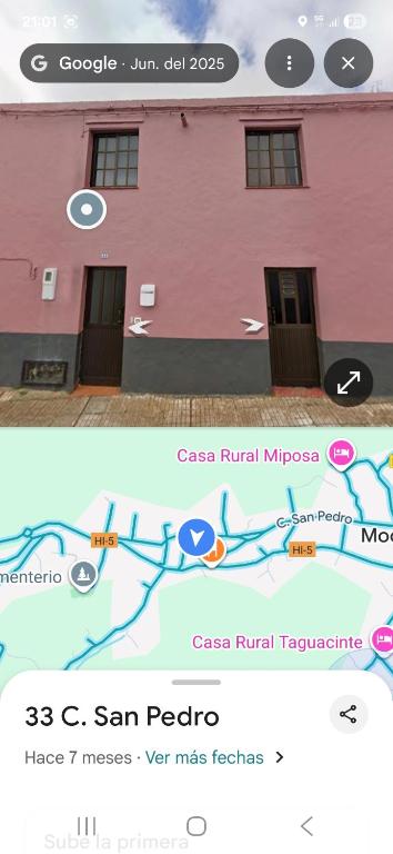 a screenshot of a cell phone of a pink building at Solo Tranquilidad in Mocanal