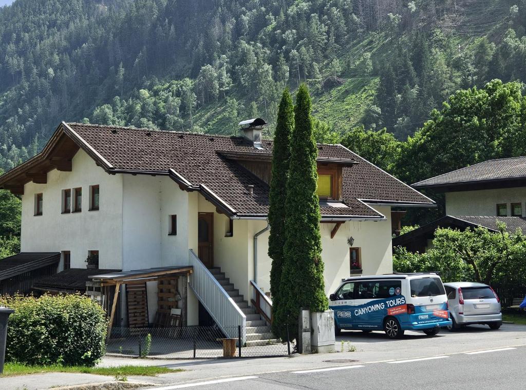 a van parked in front of a house at Ferienwohnung Bergherz in Sankt Johann im Walde