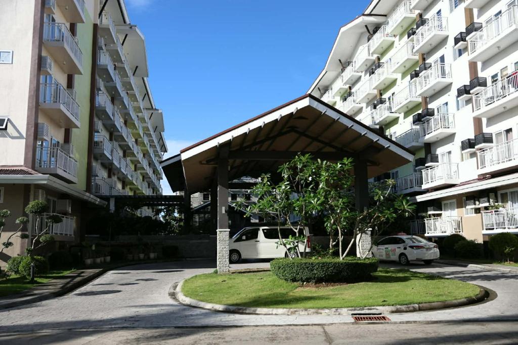 a parking lot in front of two apartment buildings at 128 C Amani in Lapu Lapu City