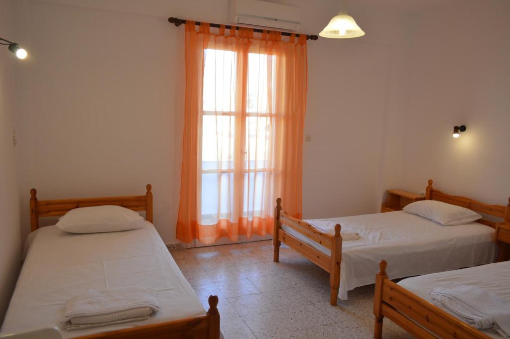 A bed or beds in a room at Koukos