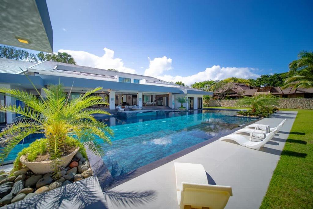 a swimming pool in the backyard of a house at Luxury villa with Private beach access in Sosúa
