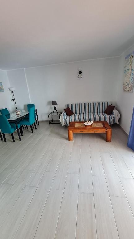 a living room with a couch and a table at a SPECIAL place in Los Cristianos
