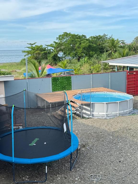 a couple of trampolines in a parking lot at Brisa marina in Moín