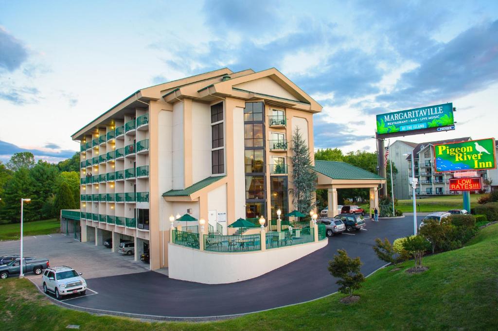 a rendering of a hotel with a parking lot at Pigeon River Inn in Pigeon Forge