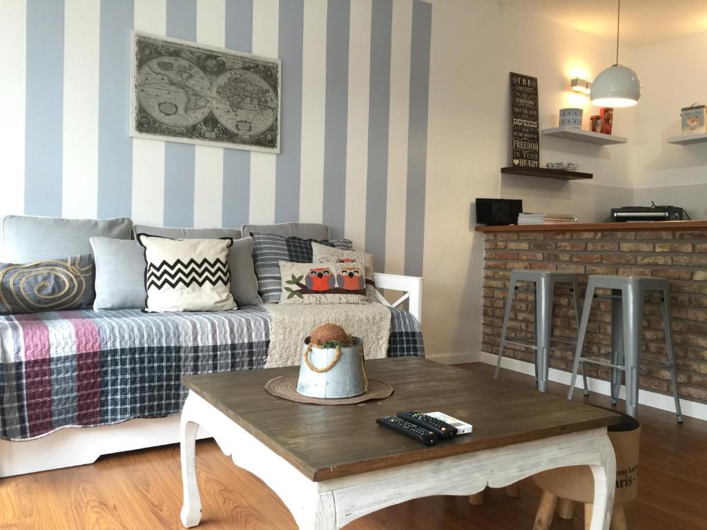 a living room with a couch and a coffee table at Design Apart in Montevideo