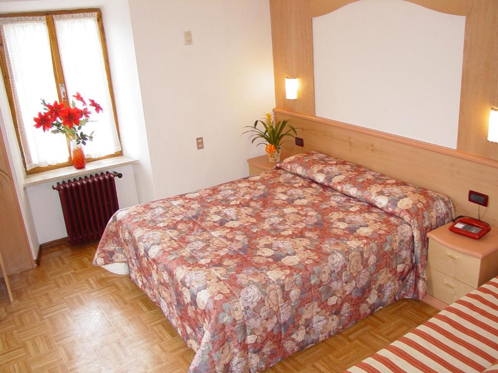 Postel nebo postele na pokoji v ubytování Hotel Europa