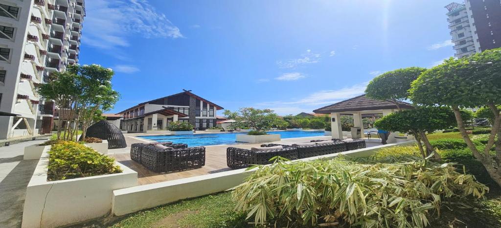a swimming pool in the middle of a building at Ubec Vacation Home - Royal Oceancrest Mactan Cebu Condominium in Cebu City
