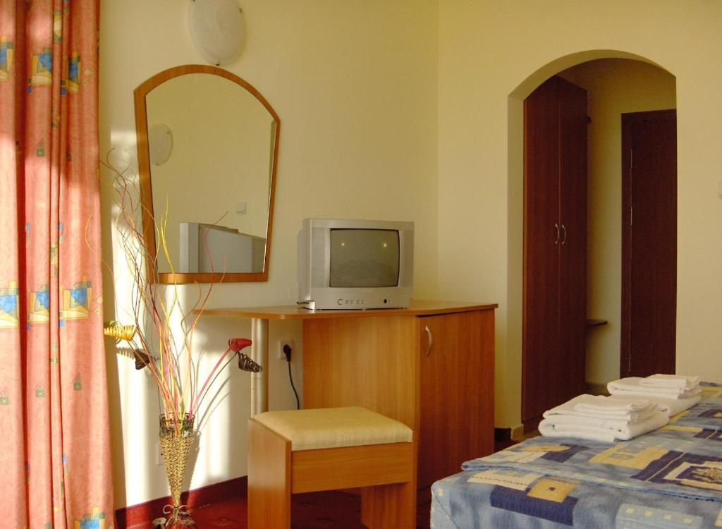 Postel nebo postele na pokoji v ubytování Hotel Varvara