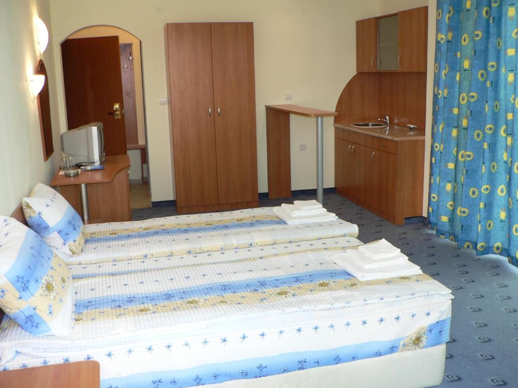 Postel nebo postele na pokoji v ubytování Hotel Varvara