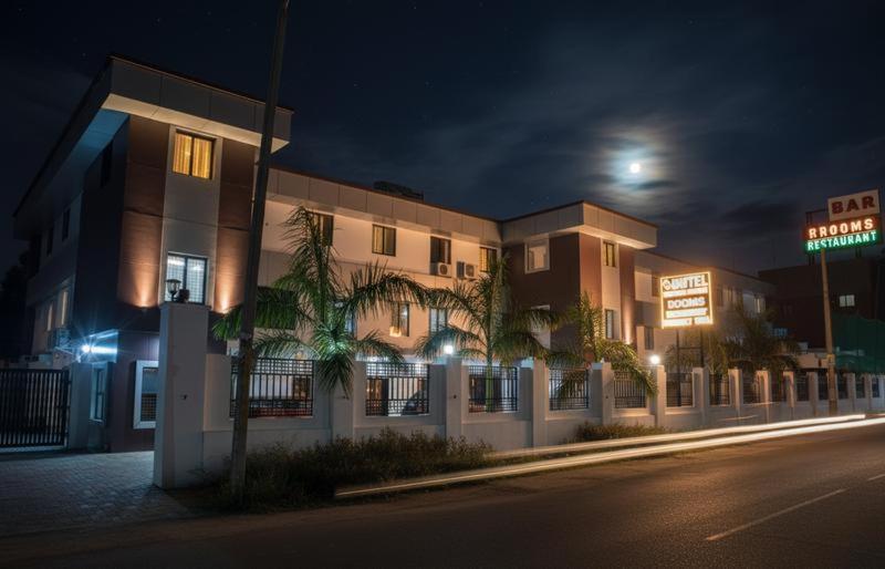 a building on a city street at night at Veliyil Towers in Alleppey