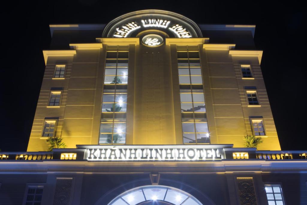 a building with a clock on top of it at Khanh Linh Hotel in Pleiku