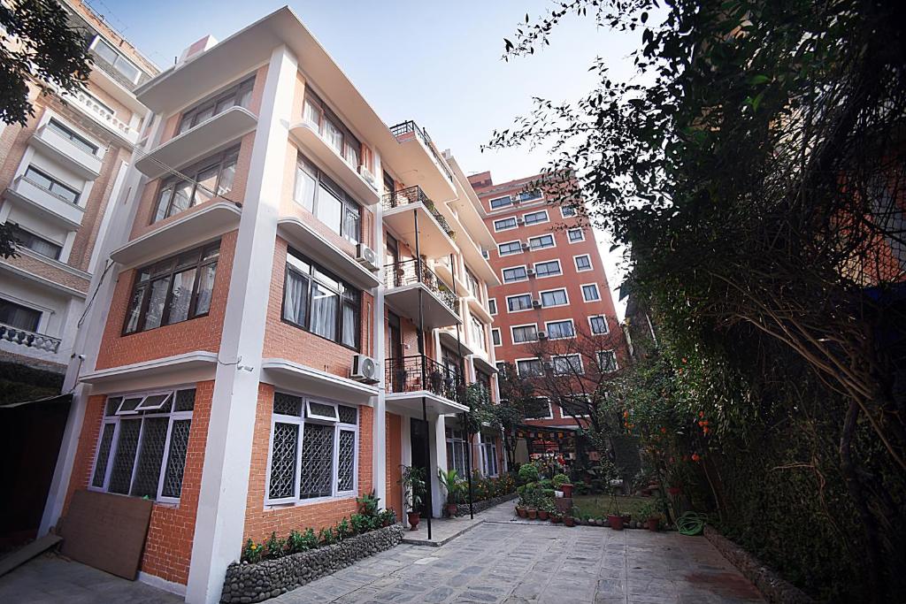 an empty street in front of an apartment building at Tibet Boutique Hotel Annex in Kathmandu