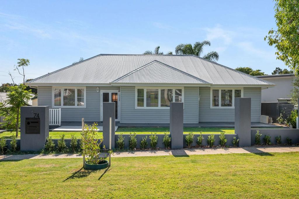 a house with a fence in front of it at Bedford Pool Oasis - Comfort near CBD & Airport in Perth