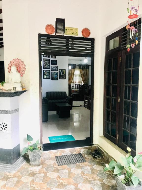 a view of a living room from the inside of a house at Shanu home stay in Beliatta